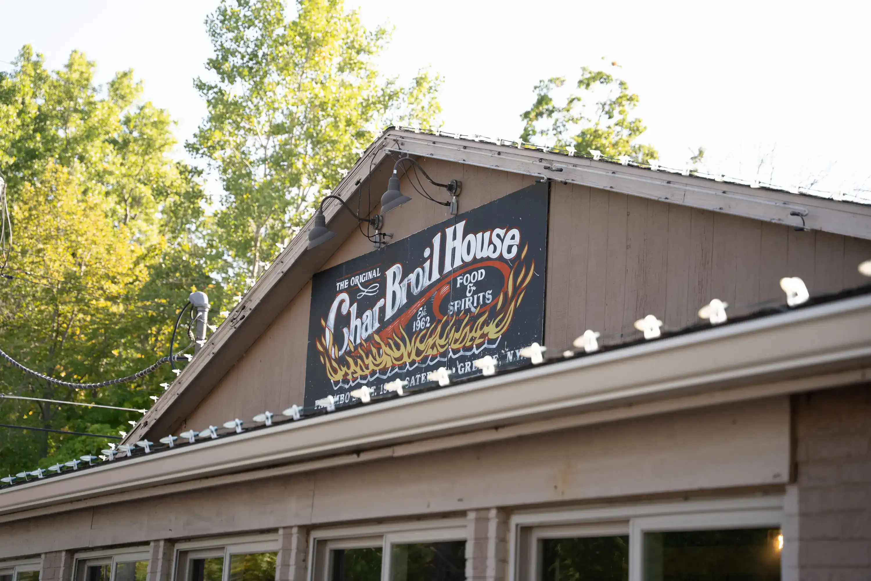 The Original Charbroil House sign with flame design on restaurant exterior