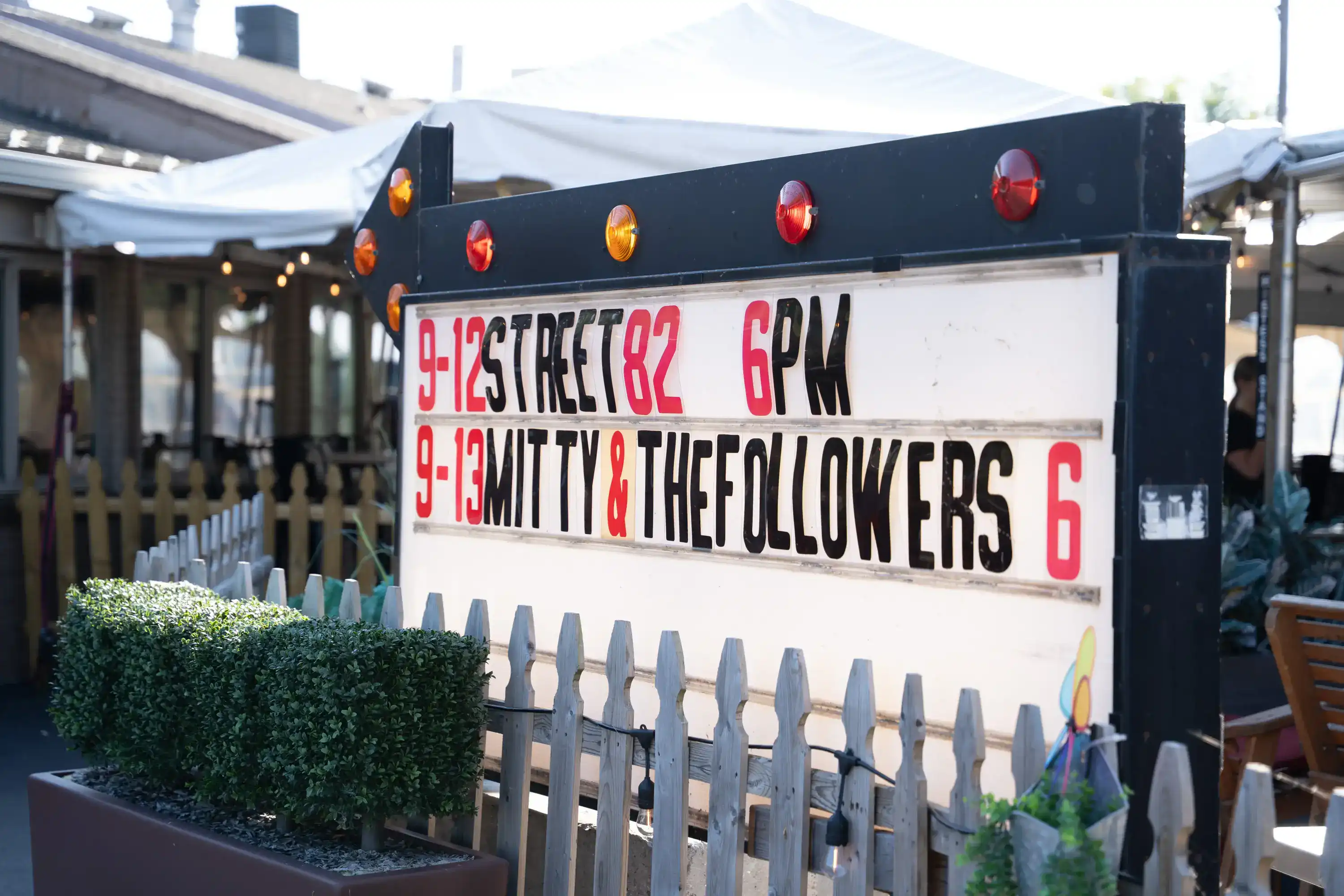 Marquee sign displaying live music events: 9/12 Street 82 6PM, 9/13 Mitty & The Followers 6PM